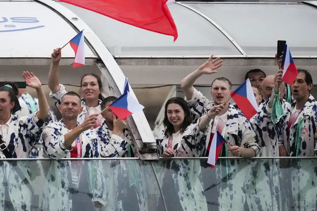 Team Czech Republic in white plastic trenches covered in what looked like artistic water blotches.Credit...