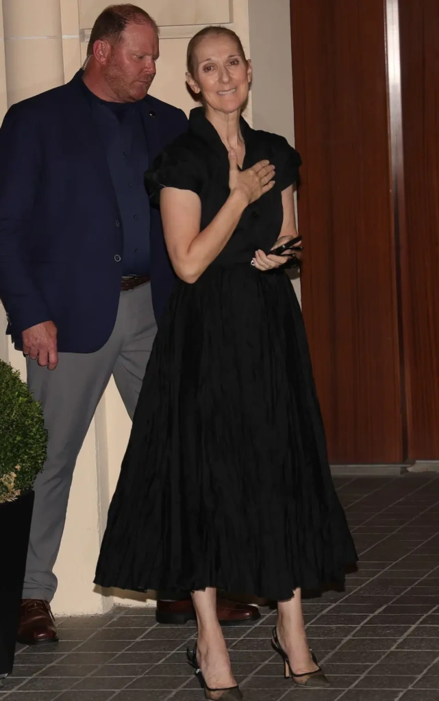 Celine Dion was seen in Paris in her own black maxi shirt dress