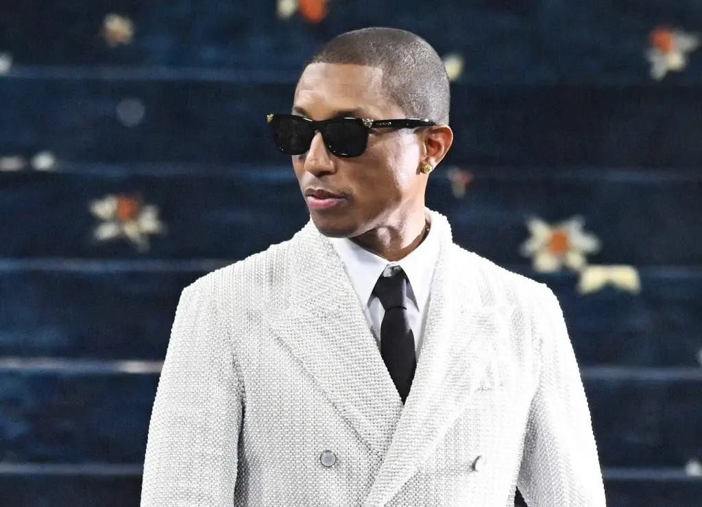 Pharrell Williams in a white suit
