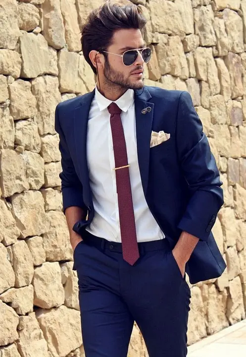 Navy blue suit, white shirt, burgundy tie and cream pocket square