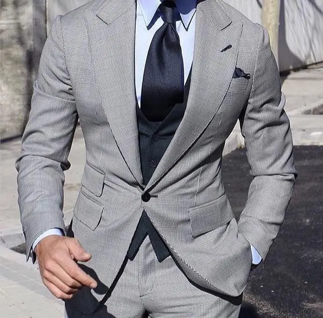 A well-styled dark grey suit combination
