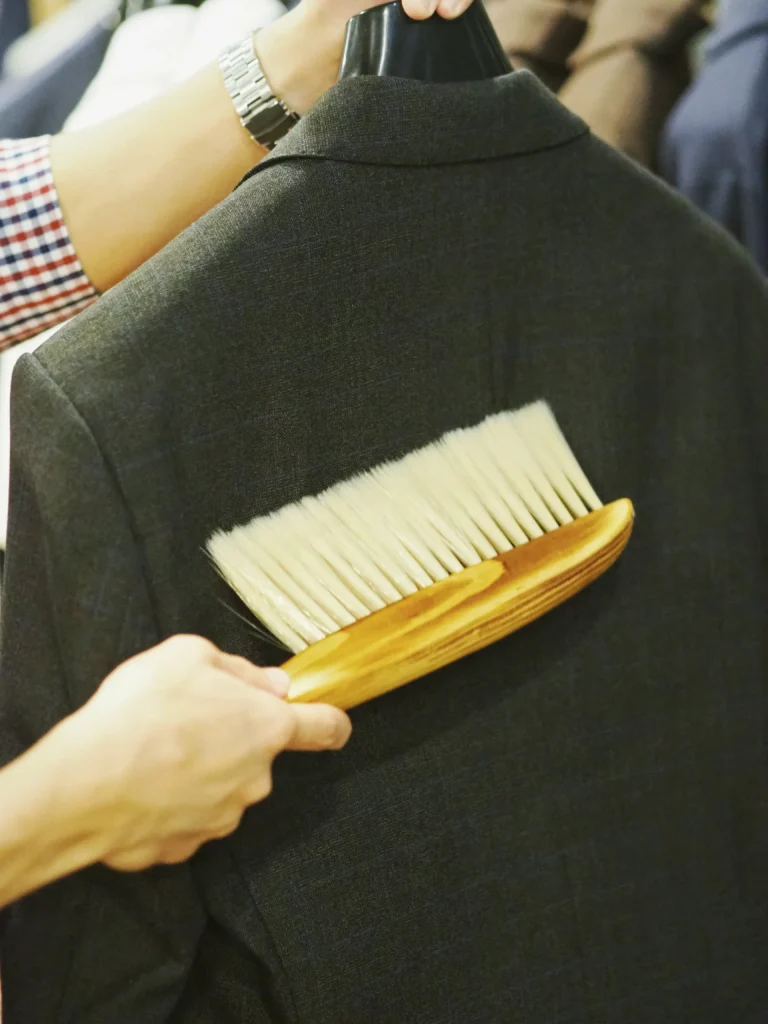 Using a Suit Brush for Surface Dirt