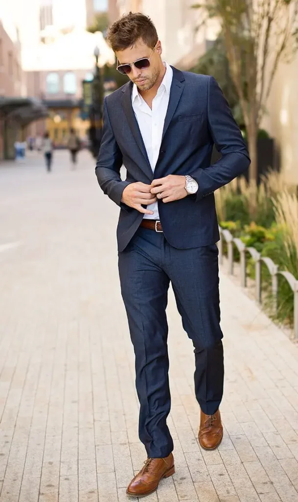 Navy blue suit paired with brown shoes.
